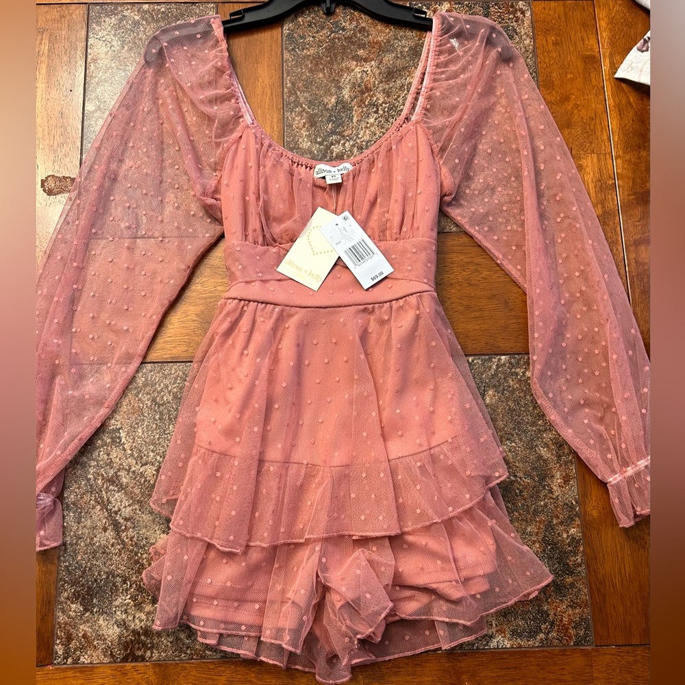 New with tags pink Allison and Kelly romper. Size XS never worn